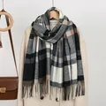 Classic checkered scarf with fringe details styled over a beige winter coat and leather bag - 182*66cm / Black