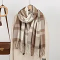 Detail of brown and beige checkered scarf with fringe paired with a winter wool coat - 182*66cm / Khaki