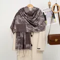 Detail of cashmere-like scarf with palm leaf patterns and fringe tassels on a coat - Botanical Leaf Jacquard / 185x70cm / YR351-02# Coffee