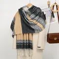 Detailed view of geometric jacquard patterns and white tassels on cashmere-like scarf - YR353-04# Black Yellow
