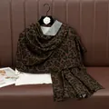 Deep brown leopard print cotton scarf styled on a hanger with a casual white top - Dark Coffee