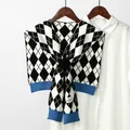 Classic houndstooth knit shawl over white shirt with blue ribbed trim and woven label - Argyle Pattern (Blue Ribbed) / Blue