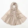 Detail showing pleated champagne linen-touch scarf with a subtle satin texture and fine hem - 180x75cm / Light Khaki