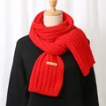 Red ribbed knit Christmas scarf with handmade label shown on a black sweater mannequin - Rib Knit with Hand Made Label (YR034)