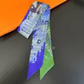 Double-sided newspaper print twilly scarf with blue and green patterns and fabric care label - Blue Green Patchwork Newspaper Style (C249-1)