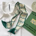 Elegant forest green twilly silk scarf with vintage geometric waves on a white shirt - Light Green BOPU
