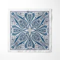 Detailed close-up of blue Paisley pattern on silk scarf with elegant satin finish - Blue