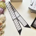Detail of elegant black and white silk twilly with horse print and geometric patterns - Pony Print