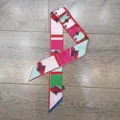 Double-sided twilly silk scarf with vibrant geometric patterns on a wooden background - Rose Magenta