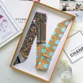 Sciarpa Twilly in seta arancione con stampe floreali e geometriche in confezione - Giallo
