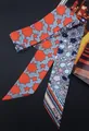 Silk-like Twilly scarf with floral geometric patterns and Paris text on black surface - Grey Red