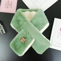 Detail of soft faux rabbit fur scarf featuring a cross-loop design and mint green contrast - Mustard Green