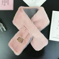 Detail of pink and gray faux fur scarf with brand label and soft plush texture - Korean Pink