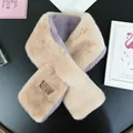 Detail of faux rabbit fur scarf with dual-tone beige and purple plush texture and leather tag - Apricot Purple