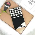 Knitted houndstooth button scarf for women on wooden background with decor - 100cm-135cm / Black