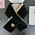 Close-up of bicolor faux rabbit fur scarf with premium leather brand label detail - Obsidian Black
