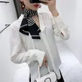 Elegant white V-neck shirt paired with a classic black and white striped silk scarf - Black