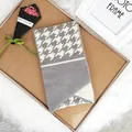 Knitted winter scarf with grey and white houndstooth pattern and button detail - 100cm-135cm / Gray