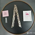 Macro detail of a leopard print silk scarf accessory with pointed ends for bag handles - Leopard Print (S177-1)