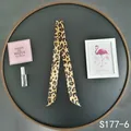 Close-up of leopard print satin twilly scarf for handbag handles in yellow and black - Ginger Leopard (S177-6)