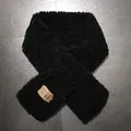Close-up of black faux lamb wool scarf with stitched square brand label on grey texture - 80-100cm / Black