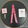Detailed view of fuchsia paisley silk scarf wrapped as a handle ribbon for handbags - Magenta Paisley (S177-15)