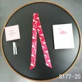 Detail of red flamingo print twilly silk scarf tied on a bag handle for decoration - Bright Red White Flamingo (S177-20)