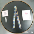 Classic plaid twilly scarf in navy and orange styled on a decorative black tray - Scotland Plaid (S177-22)