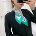 Long silk scarf featuring green tropical leaves and bold leopard print patterns - Beige Green Base