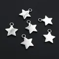 Close-up of six silver star pendants for DIY jewelry making on a dark matte surface - Silver Star Charm (F3-15)