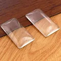 Macro view of two clear rectangular glass cabochons with smooth domed surface for DIY - 25x38mm Rectangle Glass Cabochon