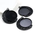 Close-up of rotating black alloy 25mm pendant trays with crescent hollow patterns - Black