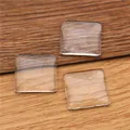 Set of square clear glass cabochons for DIY jewelry and crafts on wood background - 30mm Square Glass Cabochon