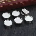 Set aus 6 silbernen DIY Schmuck-Rohlingen auf Vintage-Holz zum Basteln von Anhängern - Antiksilber