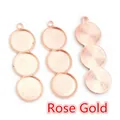 Detail of three rose gold DIY pendant trays with beaded edges and 12mm round settings - Rose Gold