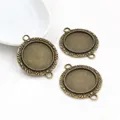 Three antique bronze 20mm round double-loop pendant bases with vintage leaf relief borders - Antique Bronze