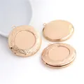 Detailed view of rose gold copper locket pendants with intricate floral engravings - Rose Gold