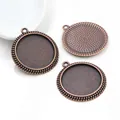 Detailed macro view of three vintage bronze 25mm round pendant trays for DIY jewelry making - Copper