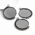 Macro view of gunmetal alloy rotating DIY pendant trays with beaded decorative edges - Gunmetal