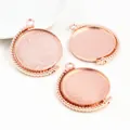 Three rose gold 25mm rotating round pendant bases with milgrain edges for DIY jewelry making - Rose Gold