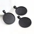 Three matte black 25mm alloy pendant trays for DIY jewelry making on white background - Matte Black Style (A6-26)