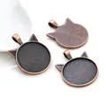 Detail of cat-eared DIY pendant bases in antique bronze finish with textured back - Cat Ear Shape Style (V1-17)