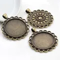 Detailed macro view of three antique bronze alloy pendant trays with lace edge - Antique Bronze Hollow Lace Style (B6-22)
