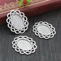 Detailed view of antique silver oval alloy cabochon bases with woven hollow edges for DIY crafts - Antique Silver Woven Hollow Frosted Base (D4-26)