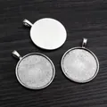 Three antique silver 30mm alloy pendant trays for DIY jewelry making on wood background - Antique Silver Round Cabochon Holder (C4-43)