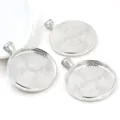 Macro shot of three silver alloy cabochon base settings with intricate grid texture for DIY - Bright Silver Interwoven Grid Style (B7-23)