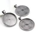 Macro detail of alloy 30mm round pendant base with textured grid for DIY jewelry making - Gun Black Radial Grid Texture Style (B7-16)
