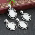 Set of 4 vintage oval alloy pendant trays for DIY jewelry making on a wooden desk - Vintage Silver Embossed Frame Oval Base (D4-42)