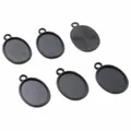 Macro detail of oval alloy pendant base with matte black finish and textured back - Black Oval Grooved Tray Style (D2-56)