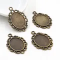 Set of four 13x18mm oval alloy pendant trays with vintage hollow lace design on white background - Antique Bronze Vintage Hollow Lace Style (D4-01)